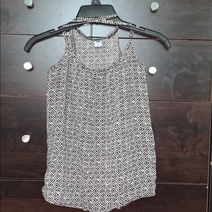 crossed strapped shirt .